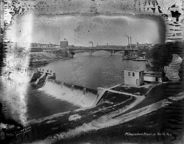 Elevated view of the Milwaukee River from the east bank at the North Avenue dam. Caption on negative reads: "Milwaukee River at North Ave".