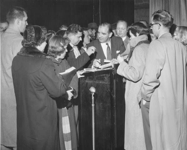 Senator Joseph R. McCarthy of Wisconsin, signing autographs during his 1952 re-election campaign