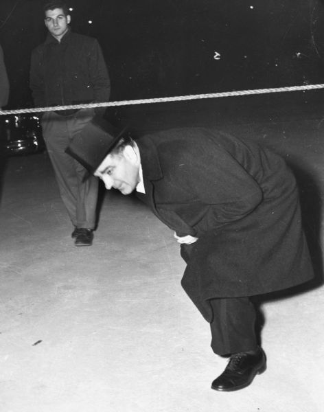 Joseph R. McCarthy arriving at the inaugural ceremonies for President Dwight D. Eisenhower.  It was unusual for McCarthy, who was very casual about his attire, to appear so well-dressed.  McCarthy was then at the peak of his influence.  With the Republican victory in November 1952, McCarthy became head of the Senate Permanent Subcommittee on Investigations.  Under his leadership, the function of the committee was broadened to encompass Communist espionage in the federal government.