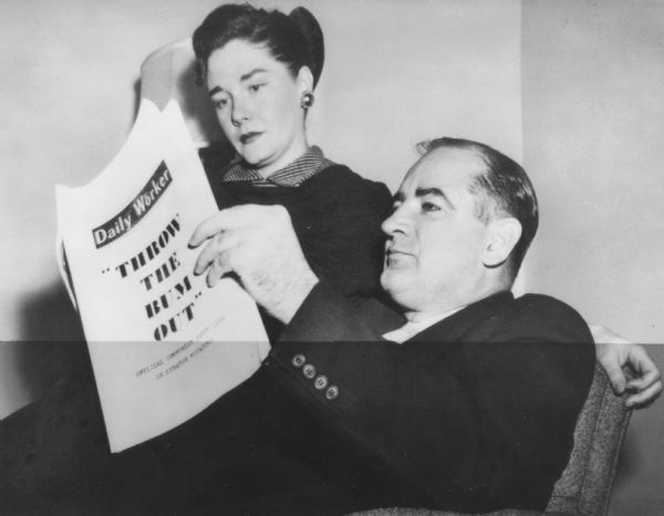 For a publicity photograph on the day the Senate censure proceedings began, Joseph R. McCarthy and Mrs. McCarthy posed for this photograph of him reading what the "Communist Daily Worker" had to say about him.