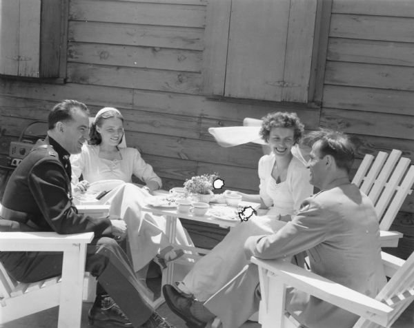 Joseph R. McCarthy in his Marine uniform at the wedding of his best friend Urban Van Susteren, at Syracus Army Air Force Base.  Helen Burlie, the maid of honor, is next to McCarthy. Margery Van Susteren is next to her husband.