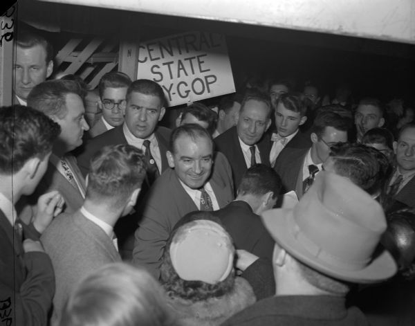 Senator Joseph R. McCarthy greets admirers at a Republican Party dinner that honored him.