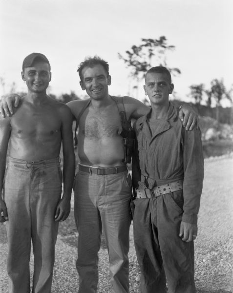 Captain Joseph R. McCarthy (center), with two unidentified Marines, somewhere in the Pacific.
