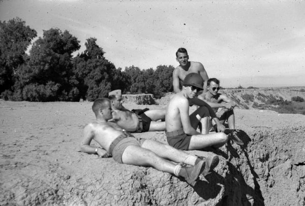 Intelligence officer Joseph R. McCarthy (wearing the cap) with a group of Marines somewhere in the Pacific.