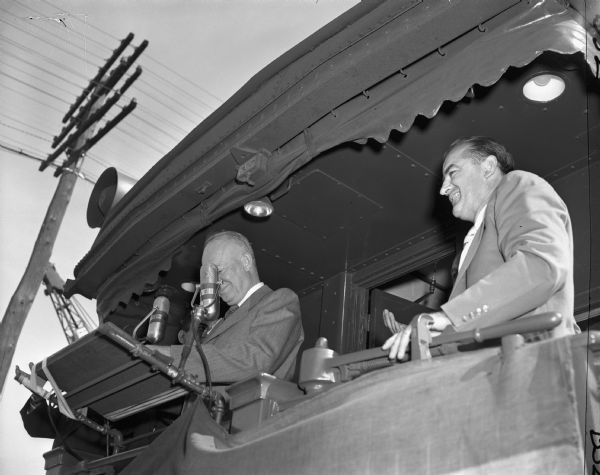 Presidential candidate Dwight Eisenhower and Wisconsin Senator Joseph R. McCarthy together on the rear car of the "Eisenhower Special." The location of this image has not been identified, but it was probably Milwaukee, since the photographer, Bob Boyd, worked for a Milwaukee newspaper. By this time, relations between Eisenhower and McCarthy were tense, at least on Eisenhower's part. A few days earlier in Green Bay Eisenhower refused to appear with McCarthy in public. In Milwaukee, however, Eisenhower delivered a speech from which he deleted strong support for General George C. Marshall, one of McCarthy's favorite targets, in an apparent effort not to offend McCarthy's supporters.