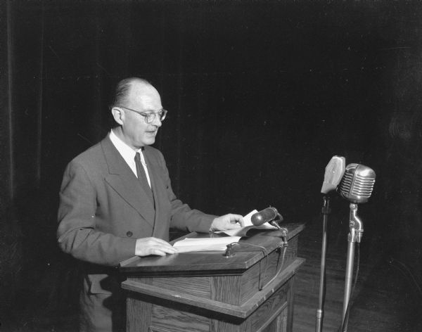 Owen D. Lattimore speaking to an audience.  Although the photograph is not identified, it was undoubtedly taken at an appearance at the University Union Theatre.  Lattimore, a Far East expert and former State Department adviser, had been widely attacked by Senator Joseph R. McCarthy as a Soviet agent, and his appearance on the University campus had been attacked by some.