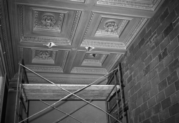 Southeast corner of Room #227,in the Wisconsin Historical Society. The old Periodicals Room, showing the original ceiling decoration and new wall construction.