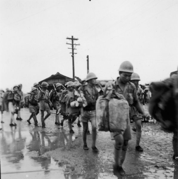 Nationalist Chinese Army soldiers evacuated fron Hainan arriving in Formosa in May 1950.  Their arrival was covered by NBC foreign correspondent Cecil Brown, whose papers are part of the collections of the Wisconsin Historical Society Archives.  The fall of Nationalist China and Chiang Kai-Sheck's retreat to Formosa in December 1949 was evidence for many Americans that the charges of Joseph R. McCarthy and the right-wing China Lobby about communists in the U.S. State Department were true.