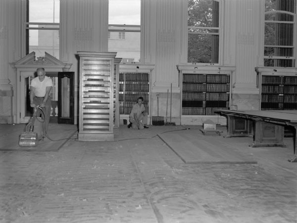 Construction work in the Historical Society Library Reading Room in preparation for installing linoleum floor tiles.