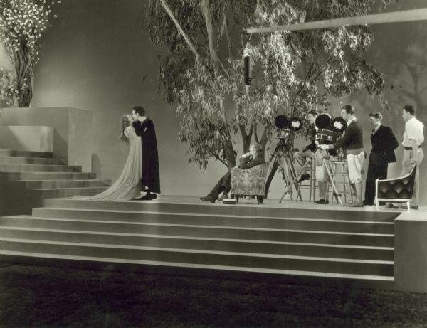 Lionel Barrymore directs John Gilbert and Norma Shearer in a scene from "Romeo and Juliet" for MGM's Hollywood Revue.