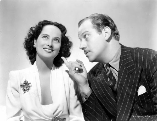 Merle Oberon and Melvyn Douglas in a publicity still for <i>That Uncertain Feeling</i> (United Artists, 1941).
