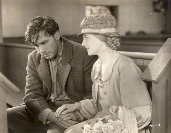 The Man (George O'Brien) suffers with guilt as he remembers his wedding vows, while the Wife (Janet Gaynor) comforts him, in a scene still from "Sunrise: A Song of Two Humans" (Fox, 1927).