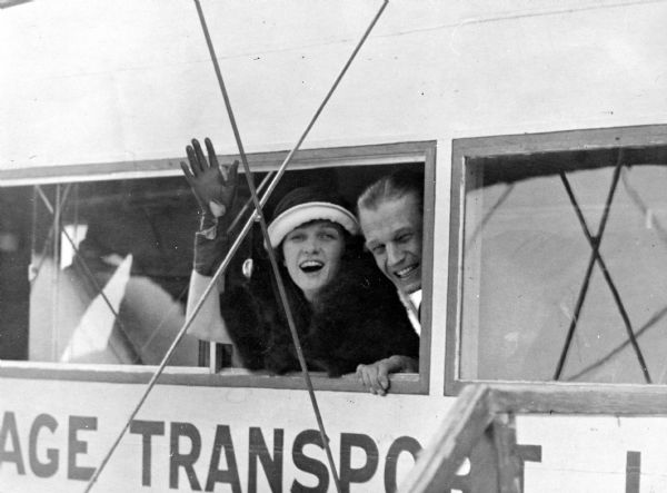 Original caption: "Irene Castle and her husband, Robert Treman, leaving London for Paris via the aerial route on Mrs. Castle's latest trip abroad."