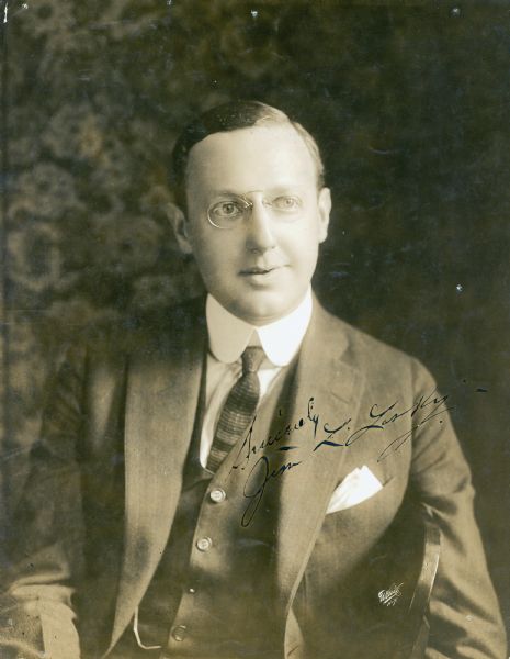 Undated studio portrait of Jesse Lasky, pioneer motion picture producer, with his autograph.