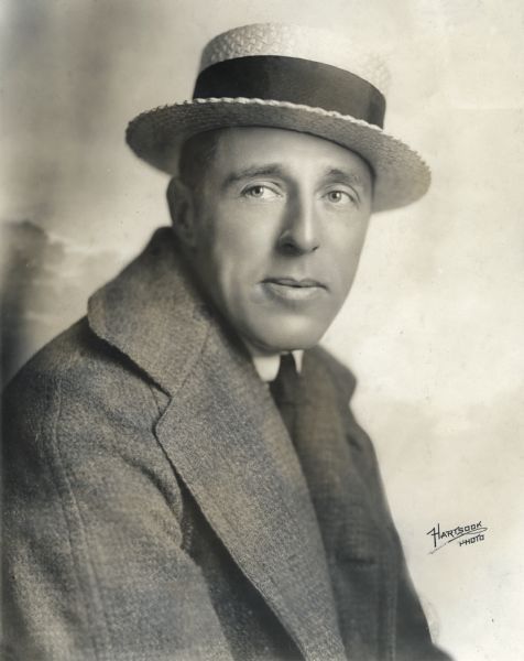 Studio portrait of director D. W. Griffith wearing a straw boater. Original caption: "David W. Griffith, Reliance-Majestic."