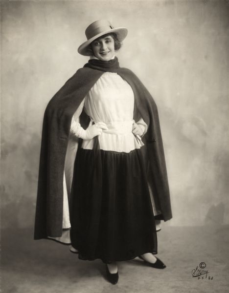 Portrait of Billie Burke distributed as publicity for the 1916 Kleine film <i>Gloria's Romance</i>. Her costume is a modified gaucho outfit, with hat, cape, and voluminous skirt.
