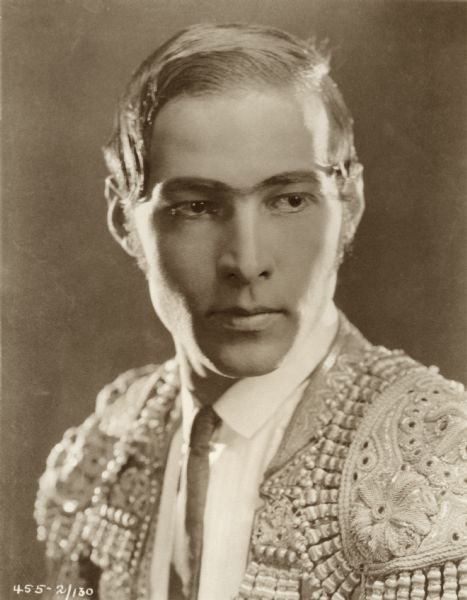 Head and shoulders portrait of Rudolph Valentino dressed as the matador Juan Gallardo in the 1922 Famous Players-Lasky production <i>Blood and Sand.</i>