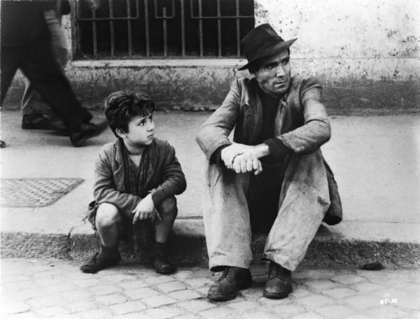 Enzo Staiola, playing Bruno Ricci, and Lomberto Maggiorani, as his father Antonio, in Vittorio De Sica's <i>Ladri di biciclette (The Bicycle Thief,</i> 1948).