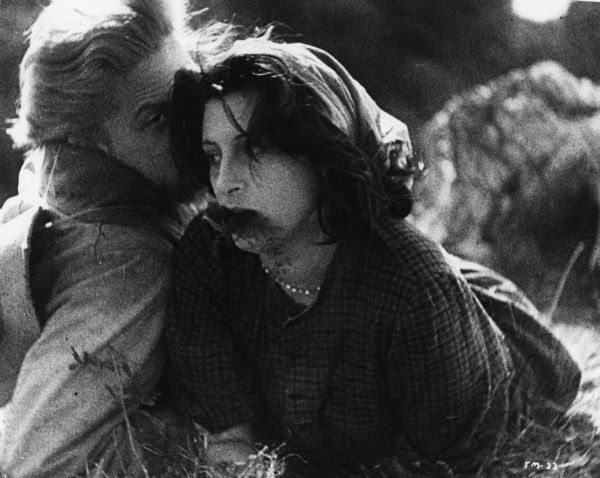Scene still of Federico Fellini as the stranger and Anna Magnani as Nanni, in the second segment (Il Miracolo) of Roberto Rossellini's <i>L'Amore: Due Storie D'Amore (Ways of Love,</i> 1948).