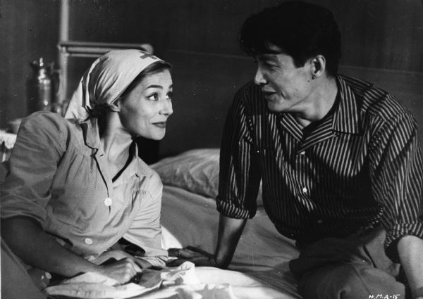 Scene still of Emmanuele Riva, as she, and Eiji Okada, as he, in Alain Resnais's <i>Hiroshima mon amour</i> (1959).
