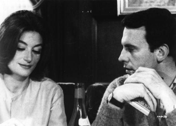Scene still of Anne Gauthier and Jean-Louis Duroc (played by Anouk Aimée and Jean-Louis Trintignant) in Claude Lelouch's <i>Un homme et une femme (A Man and a Woman,</i> 1966).
