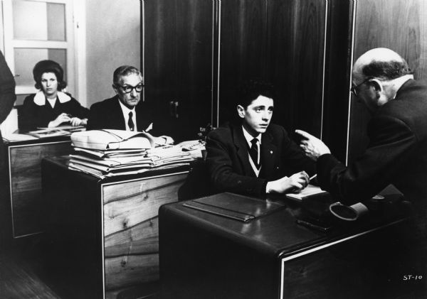 Scene still with Sandro Panseri, as Domenico Cantoni, a young clerk being chastised by his boss, in Ermanno Olmi's <i>Il Posto (The Sound of Trumpets,</i> 1961).