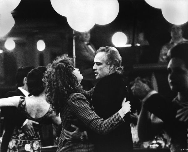 Maria Schneider as Jeanne and Marlon Brando as Paul dancing in Bernardo Bertolucci's <i>Ultimo tango a Parigi (Last Tango in Paris,</i> 1972).