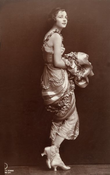 Full-length publicity portrait of Irene Castle in a tripping pose for Irving Berlin's 1914 Broadway musical <i>Watch Your Step.</i>