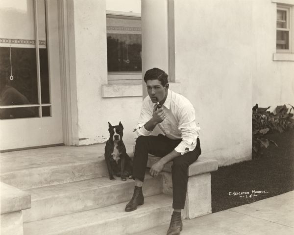 Cullen Landis, an actor in many Paramount and Goldwyn silent films, posed with a bulldog and a pipe.