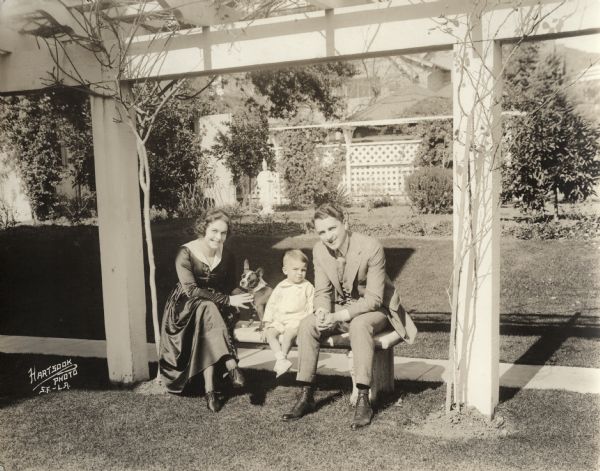 Original caption:
"Mr. and Mrs. Bryant Washburn and Bryant Washburn IVth and his dog 'Kewpie' taken in the garden of their home at 7003 Hawthorne Avenue, Hollywood, California."