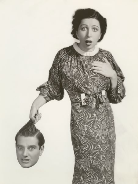 Promotional trick photograph of the husband and wife vaudeville team Block and Sully (Jesse Block and Eva Sully). She holds his severed head by the hair, an effect both ghastly and humorous.