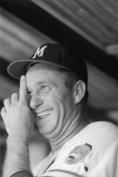 Milwaukee Braves pitcher Lew Burdette laughing and scratching his forehead. Probably taken during spring training 1959 at Ninth Street Park in Bradenton, Florida.