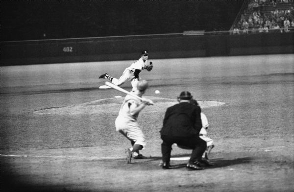 View from behind home plate of Lew Burdette delivering a pitch in the Milwaukee Braves' 1-0 victory over the the Philadelphia Phillies, August 18, 1960 at County Stadium. Burdette threw a no-hitter in the game, allowing only a single Phillies batter to reach base. Burdette led off the eighth inning with a double and scored the only run of the game on another double by Bill Bruton.