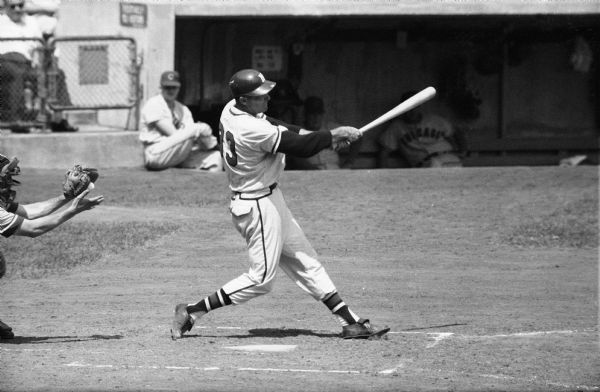 Lew Burdette, pitcher for the Milwaukee Braves baseball team, swinging a bat against the Chicago Cubs on June 8, 1959. Burdette, always known as a good hitter, went 4 for 4 with 4 RBIs and a run scored on his way to a 9-5 victory.
