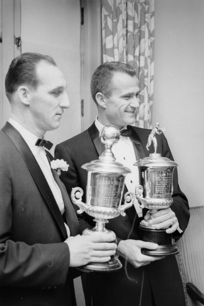 Milwaukee Braves pitchers Warren Spahn (left) and Lew Burdette posing with awards they recieved at the 5th Annual Diamond Dinner, hosted by the Milwaukee Chapter of the Baseball Writers Association of America, on January 30, 1958 at the Elk's Clubhouse in Milwaukee. Spahn and Burdette were honored for their achievements during the Braves' World Championship 1957 season.