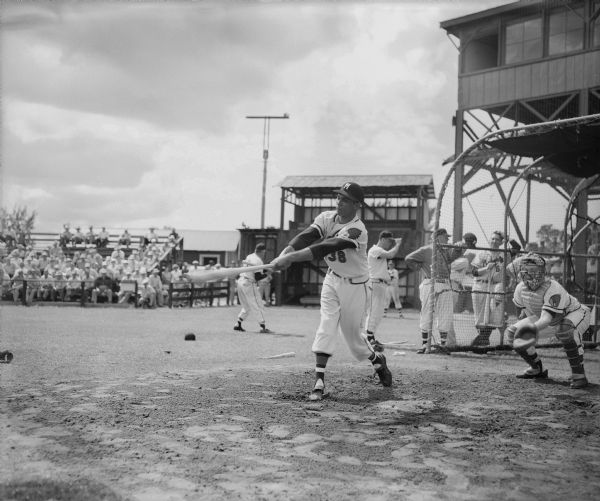 Milwaukee Braves outfielder Bill Bruton taking batting practice during spring training. Bruton led the National League in stolen bases in 1953, '54, and '55.