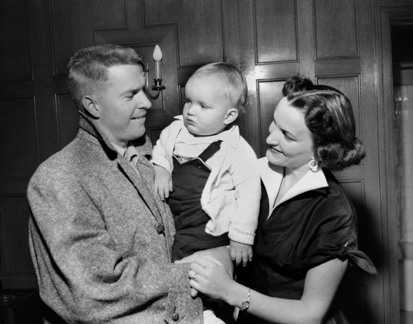 Milwaukee Braves catcher Del Crandall poses with his wife and child.