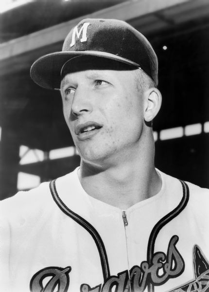Head and shoulders portrait of Milwaukee Braves outfielder John DeMerit.  Demerit, a West Bend, Wisconsin native, was signed out of the University of Wisconsin on May 26, 1957 as a 21-year old bonus baby.  DeMerit saw action in 33 games in 1957 and played for the Braves from 1957 through 1961.