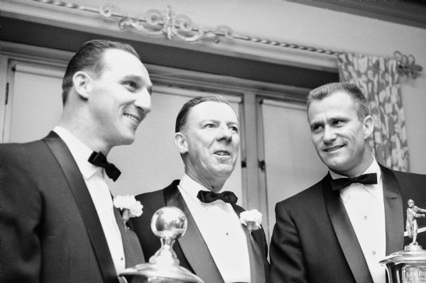 Milwaukee Braves pitchers Warren Spahn (left) and Lew Burdette (right) flank Braves' General Manager John Quinn at the 5th Annual Diamond Dinner hosted by the Milwaukee Chapter of the Baseball Writers Association of America, January 30, 1958 at the Elk's Clubhouse in Milwaukee. All three received awards for their accomplishments during the Braves' 1957 World Championship year.