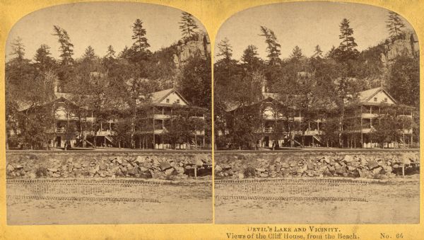 View of the Cliff House, a resort near Devil's Lake. Caption on stereograph reads: "Devil's Lake and Vicinity. Views of the Cliff House, from the beach."