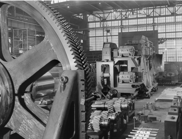 This drive was purchased by Pennsylvania Engineering and used by Republic Steel Cleveland. Falk caption reads,"BOF drive, for specifications see Engineering File." An employee stands in the background.