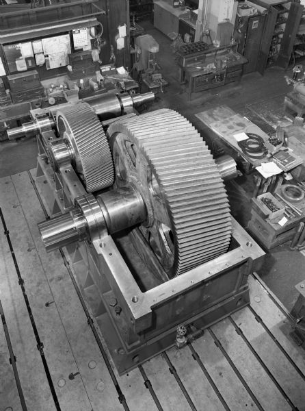 View of an autogenous mill from above. This unit was purchased by Hardinge Company, a division of Koppers Incorporated and used by the Cleveland Cliff Empire IV. Falk caption reads, "Along with order are four 34 foot ring gears."