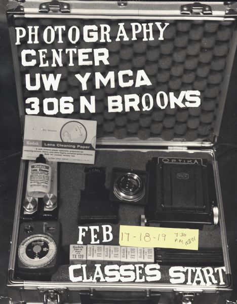 Poster advertising photograph classes at the University of Wisconsin YMCA. A camera case with a camera, light meter, film, and lens tissue is prominately displayed.