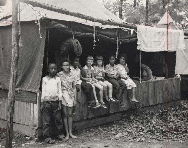 Group of children in front of a tent.  Part of Highlander Folk School's Koinonia Children's Camp.