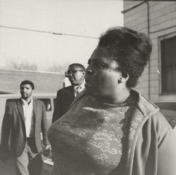 Fannie Lou Hamer (1917 - 1977), an American voting rights activist and civil rights leader, visiting the Highlander Folk School. Two men are standing in the background.