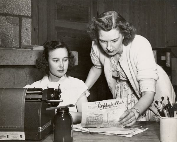 CIO school in the 1940s. Features two women reviewing the "Highlander Flash," a newsletter produced by the Highlander Folk School.