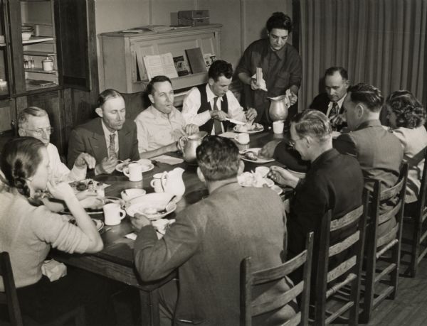 Farmers Union Workshop eating a meal together. Tom White, extreme left, was the Tennessee legislative representative of the Brotherhood of Railway Conductors.