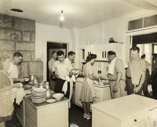 CIO students doing kitchen duty at Highlander Folk School. Myles Horton helping.