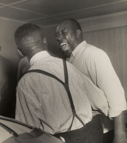 A man laughing at a Civil Rights workshop, probably in Seattle.