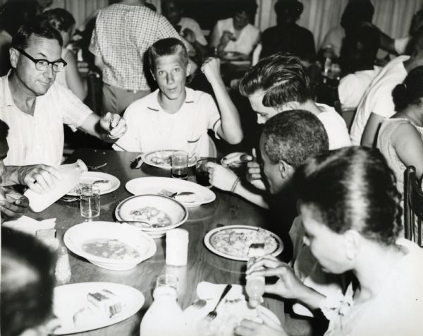 Summer Youth project, eating in dining hall Myles Horton on left, Wiley Gillmor second from left.